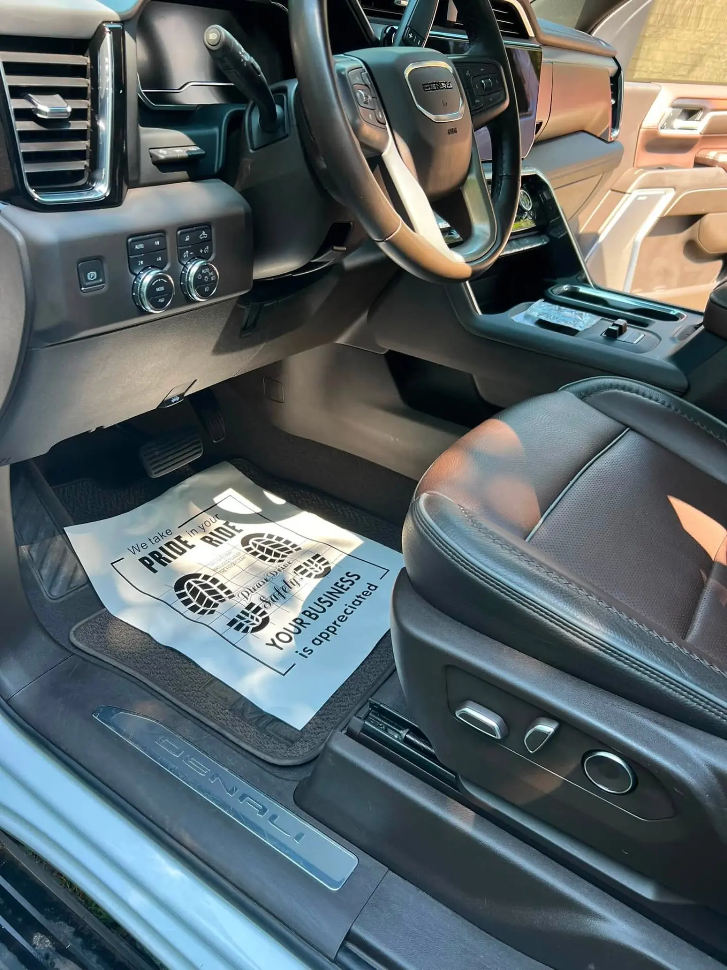 Driver footwell detailed with protective floor mat sheet